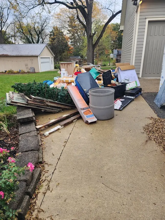 Dumpster being loaded with debris for 30 Yard Dumpster Rental in Epping